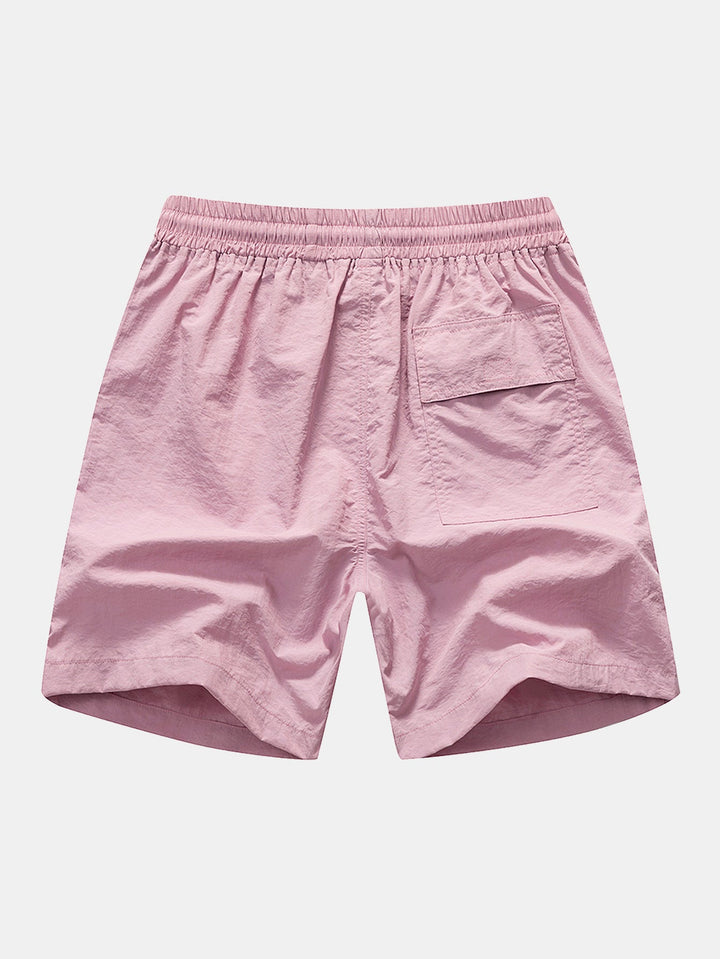 Hemd mit Palmenmuster und Shorts zum Schwimmen